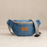 Nerakcos Denim Belt Bag - side profile view showing compact crescent silhouette