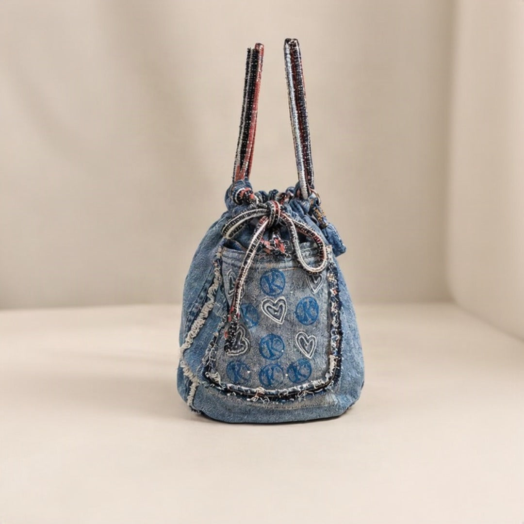 Nerakcos Denim Drawstring Bag - Front with peace signs and hearts embroidery