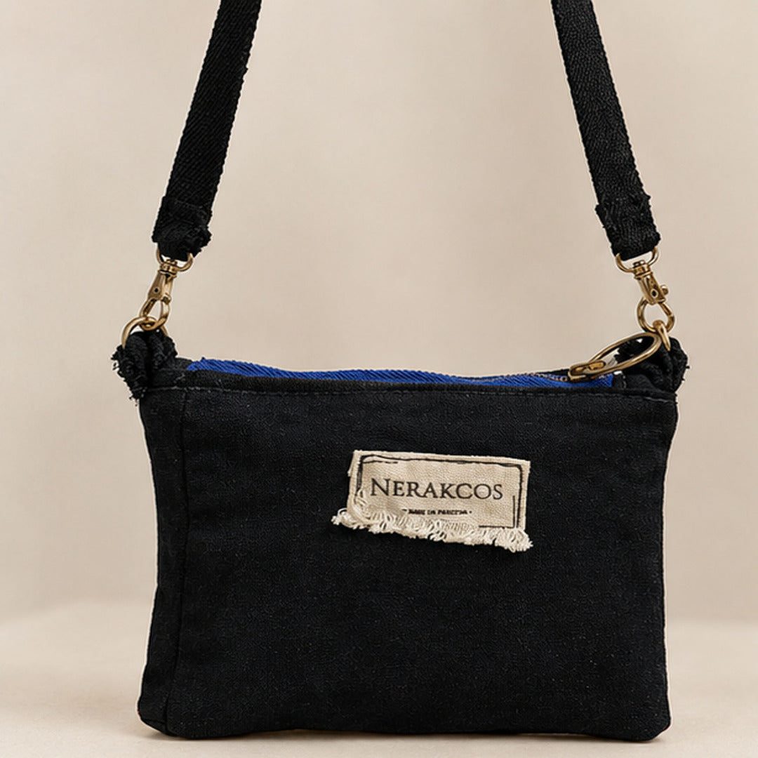 Interior view showing royal blue satin lining and gold interior zip pocket