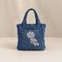 Nerakcos Lace Tote Bag - lifestyle shot, woman carrying bag in desert town