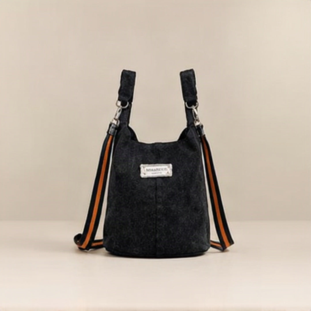 Nerakcos Black Denim Sport Bucket Bag - front studio view with orange sport straps