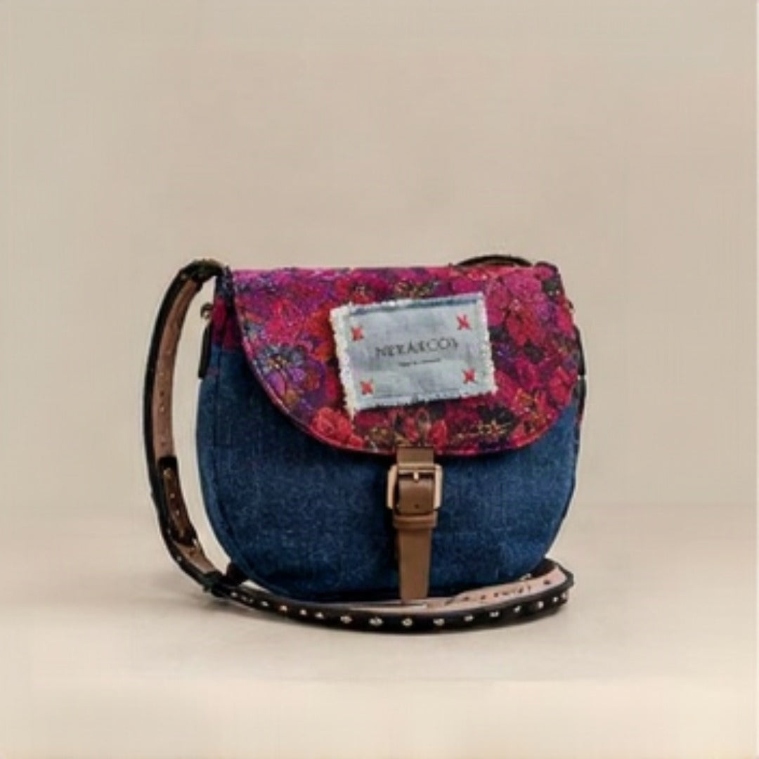 Nerakcos Floral Brocade Denim Saddle Bag - front view with Nerakcos label, studio neutral background