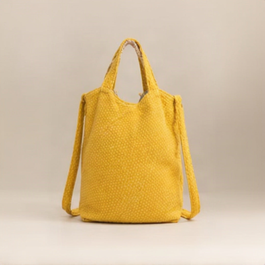 Top view showing open interior with floral lining and gold zip pocket