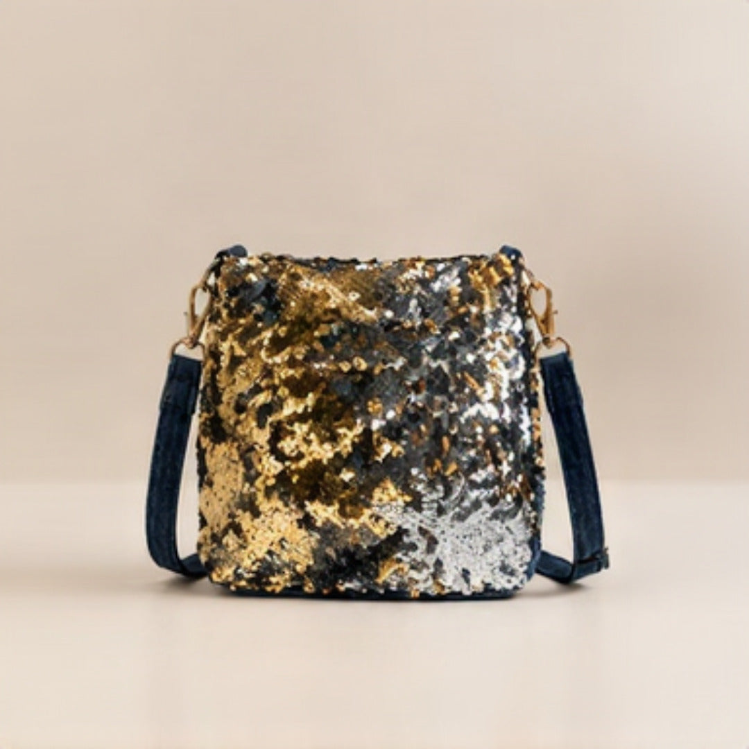 Side profile view of Nerakcos Gold Sequin Crossbody Bag showing slim curved silhouette and denim strap