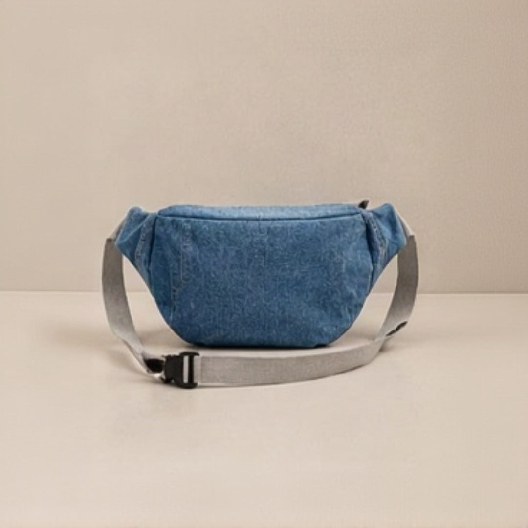 Nerakcos Denim Belt Bag - angled 3/4 view showing crinkle denim texture and cream zip trim