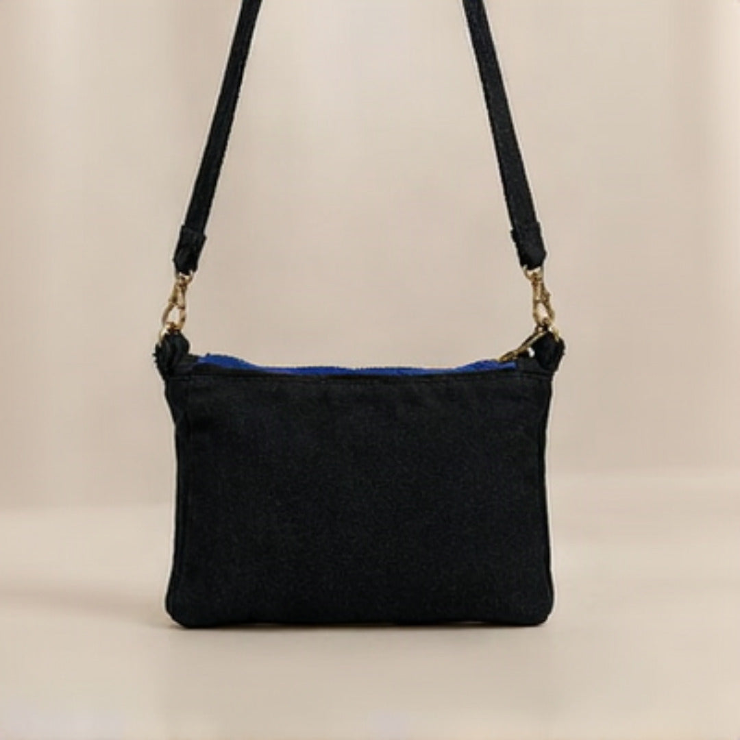 Nerakcos Black Denim Crossbody Bag - back view showing clean black denim body and strap hardware