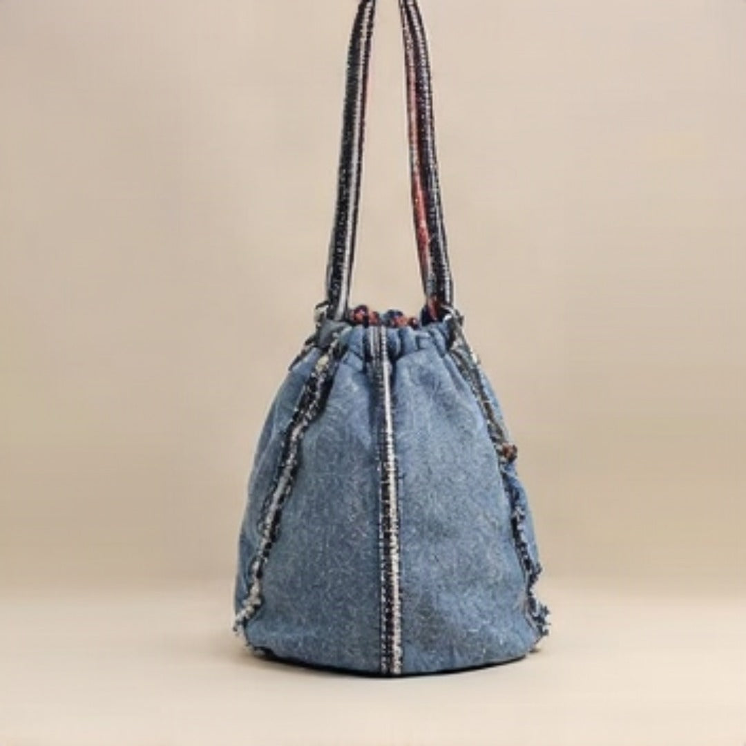 Lifestyle shot - woman carrying Nerakcos Denim Bag