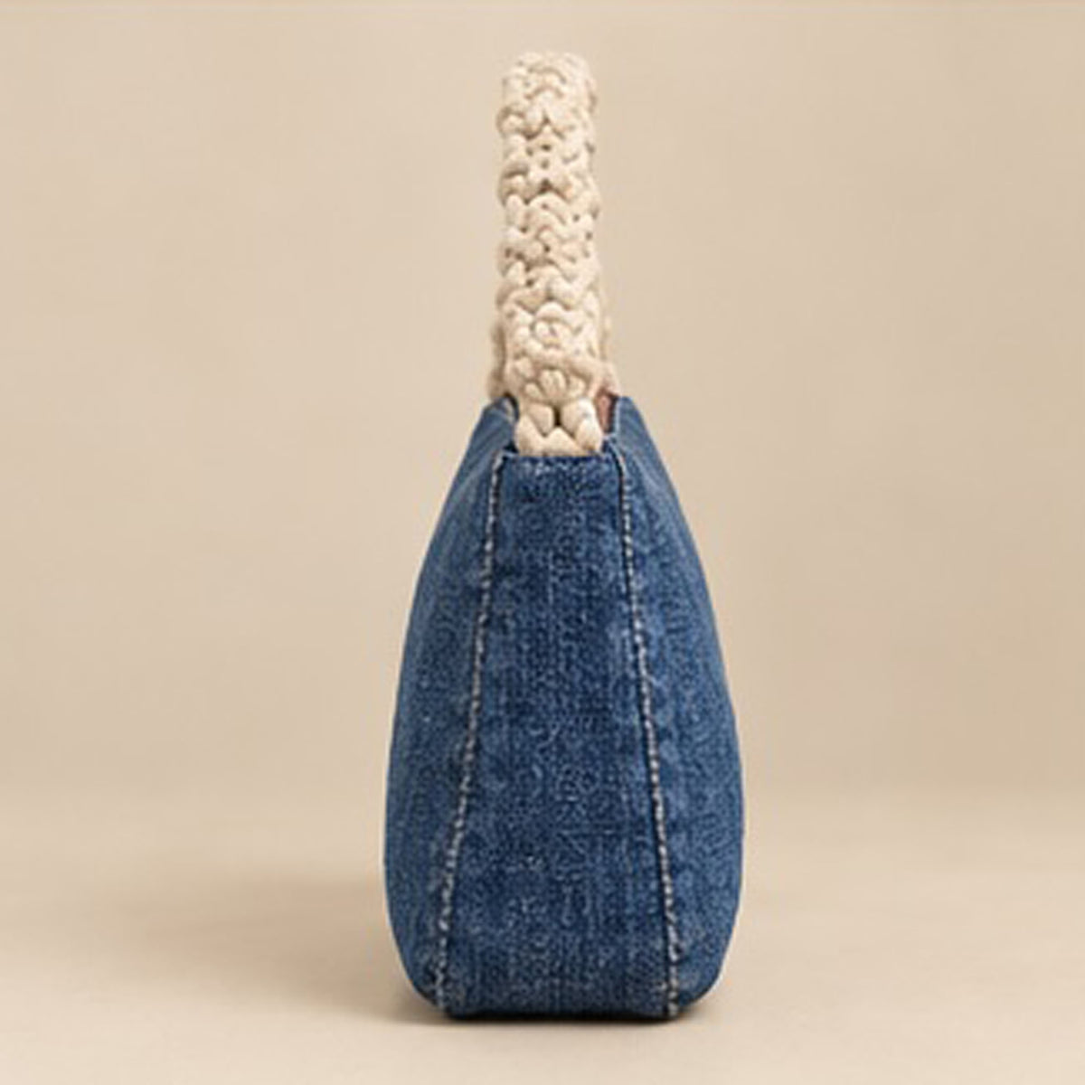 Close-up of studded Nerakcos denim label