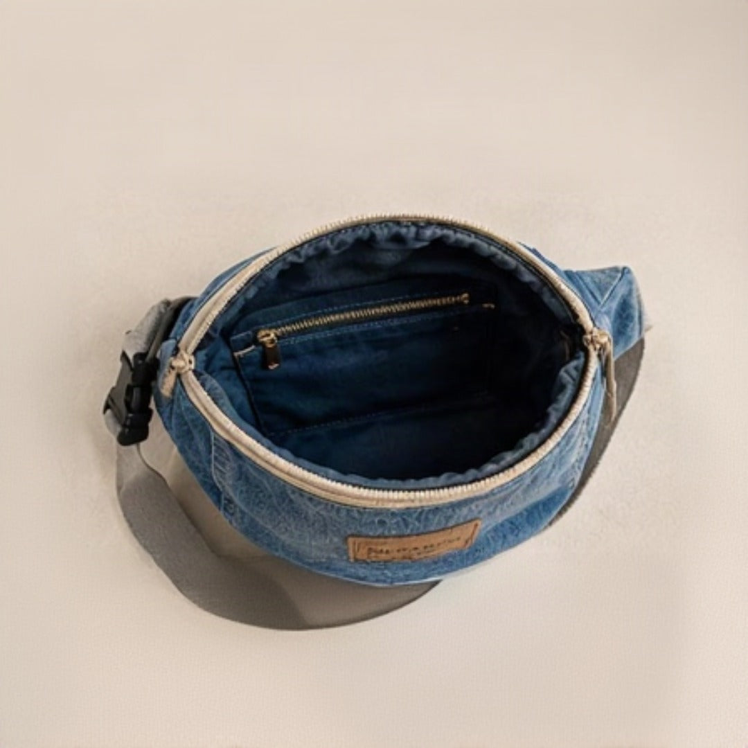 Nerakcos Upcycled Denim Belt Bag - front view with Nerakcos leather label, studio neutral background