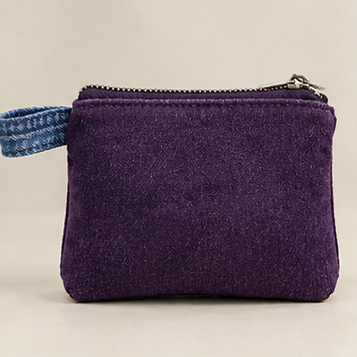 Purple-lined interior with zip pocket