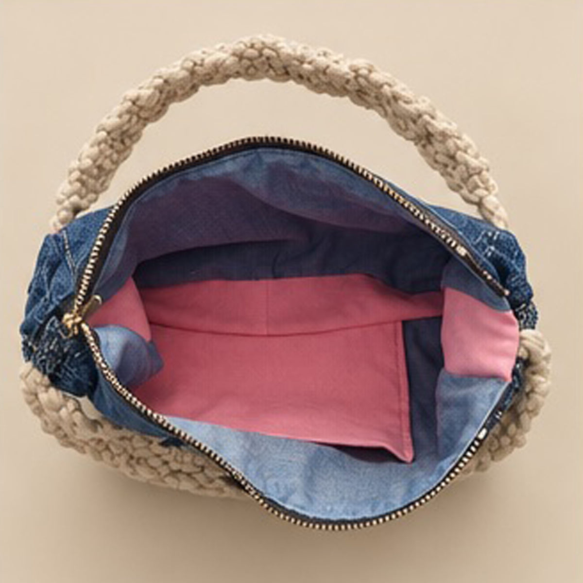 Back of denim handbag with three gold-tone studs