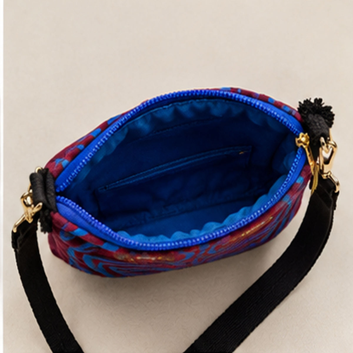 Side profile showing the bag depth and adjustable black strap
