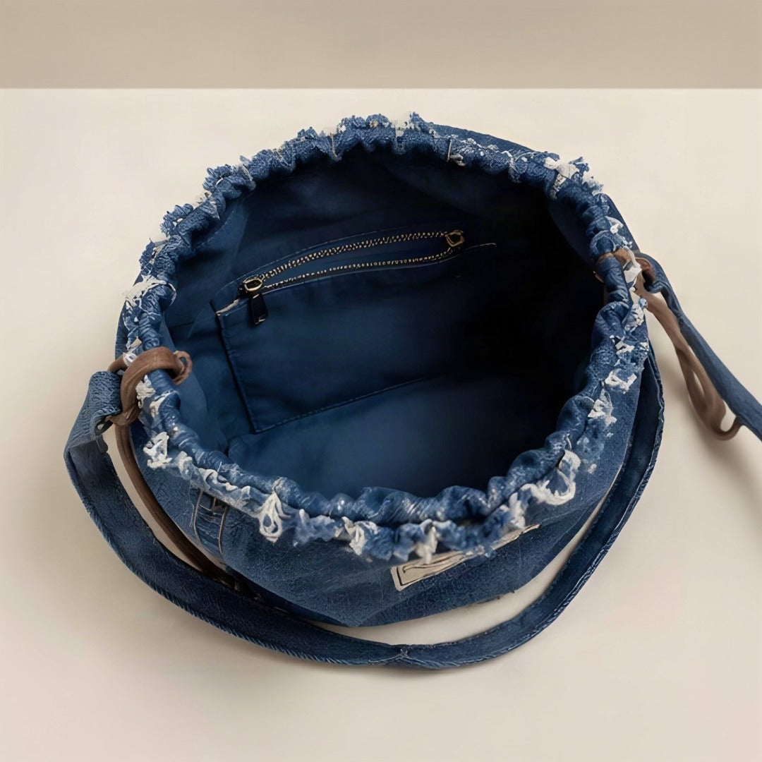 NERAKCOS brand label on denim bag