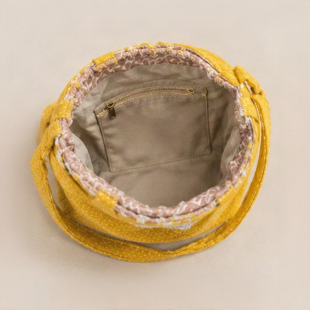 Close-up of bouclé texture with tonal dot embroidery detail