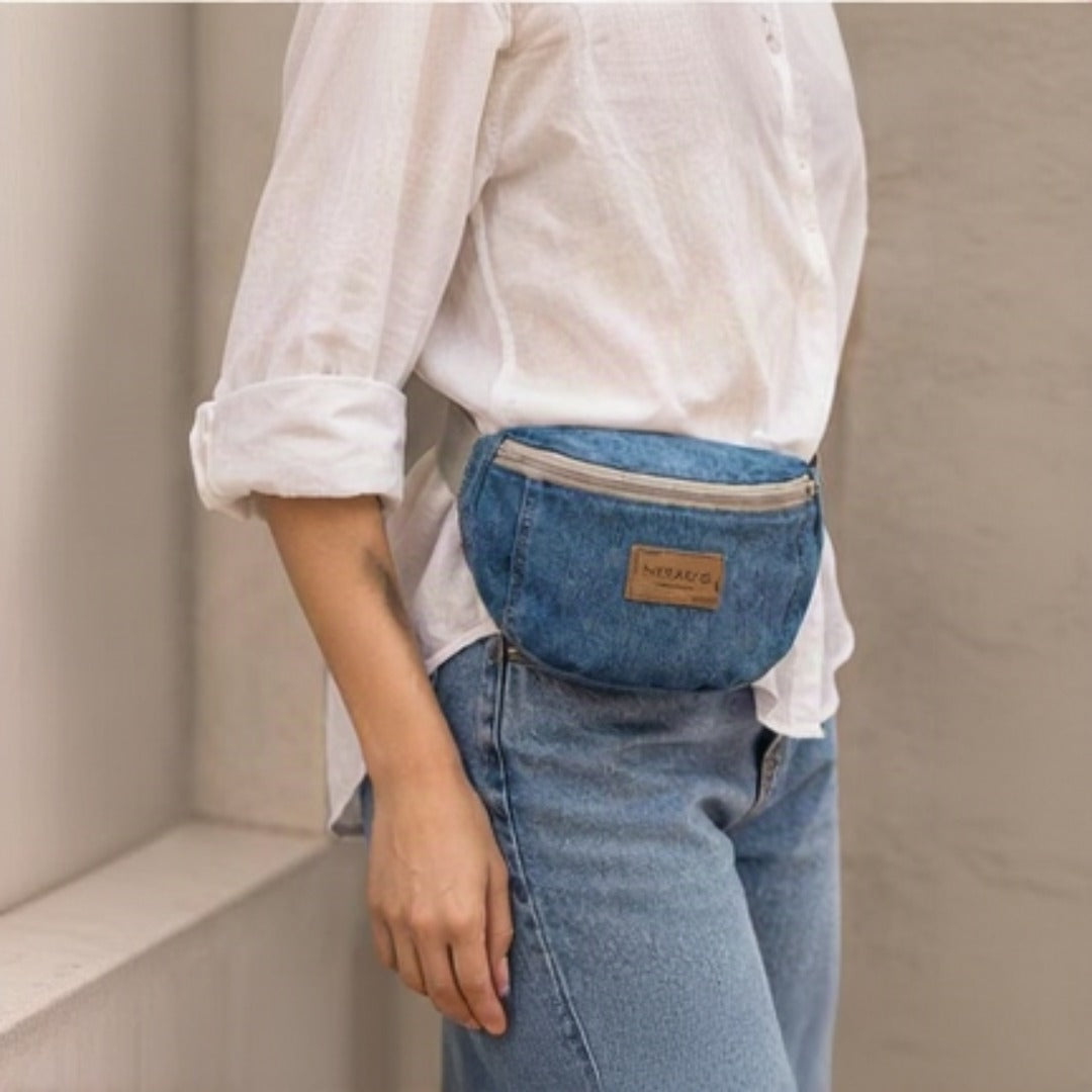 Lifestyle - model wearing Nerakcos Denim Belt Bag crossbody, back view showing grey strap