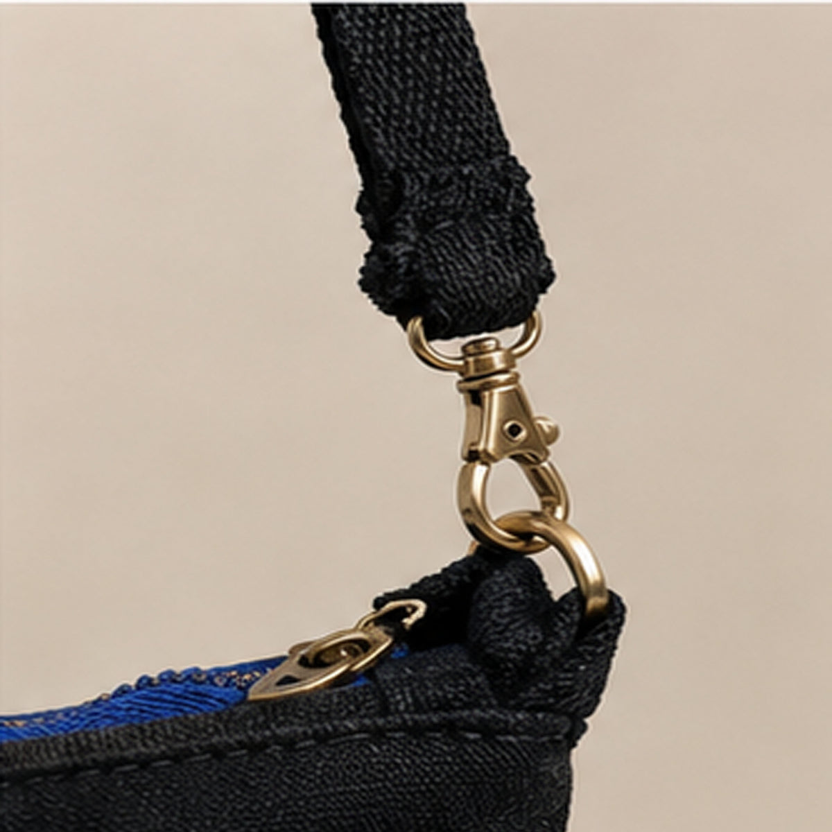 Close-up of frayed Nerakcos woven label on black denim body