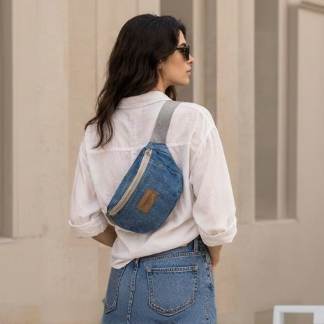 Lifestyle - model wearing Nerakcos Denim Belt Bag at hip level, front view full outfit